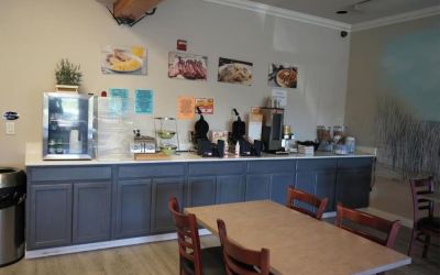 Breakfast available at Coratel Inn And Suites By Jasper Ocean Shores.