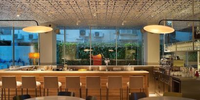 Hotel bar at night at Mendeli Street Hotel.