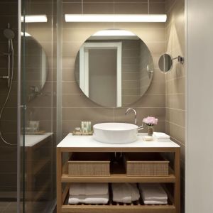 Guest bathroom with shower at Mendeli Street Hotel.