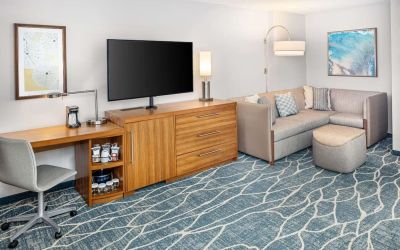 Day room with TV and work space at Hyatt Place Waikiki Beach.