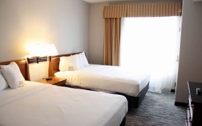 Spacious day room with two queen beds at Country Inn & Suites By Radisson, BWI Airport.