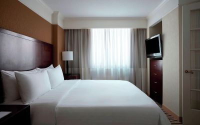 Romantic king room with TV at Washington Dulles Marriott Suites.
