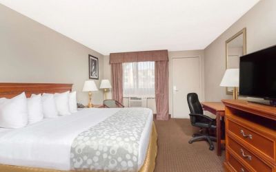Day use room with TV and work desk at Days Inn By Wyndham St Augustine/Historic Downtown.