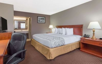 Day room with TV at Days Inn By Wyndham St Augustine/Historic Downtown.