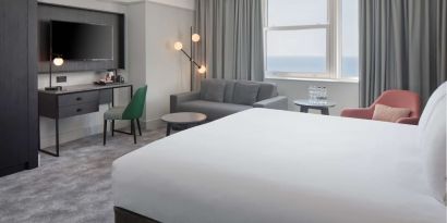 Day use room with work desk and lounge area at DoubleTree By Hilton Brighton Metropole.