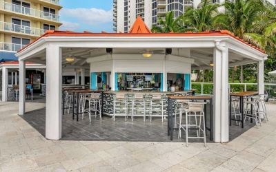 Hotel bar and coworking space at Ramada Plaza Marco Polo Beach Resort.