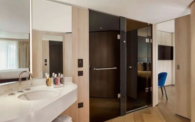 Guest bathroom with shower at The Westminster London, Curio Collection By Hilton.
