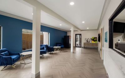 Lobby and coworking space at Signature Inn Houston Galleria.