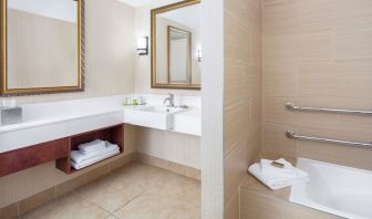Guest bathroom with tub at DoubleTree By Hilton Sunrise.