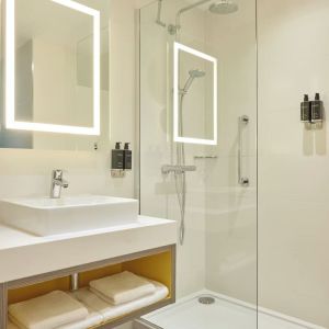 Guest bathroom with shower at Leonardo Royal Hotel Oxford.