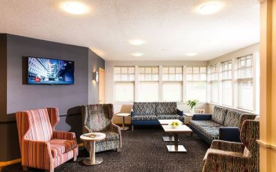 Lobby and coworking lounge at Leonardo Inn Aberdeen Airport.
