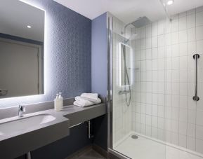Guest bathroom with shower at Leonardo Hotel Bristol City.
