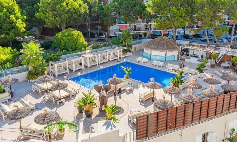 Outdoor pool with loungers at INN Mallorca Aparthotel.