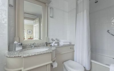 Guest bathroom with shower and tub at The Grand Brighton. 