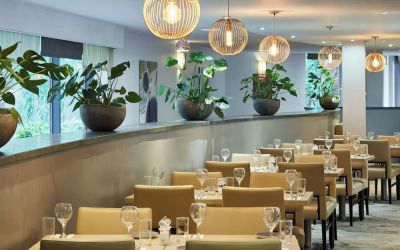 Dining area perfect for coworking at Leonardo Hotel London Heathrow Airport.