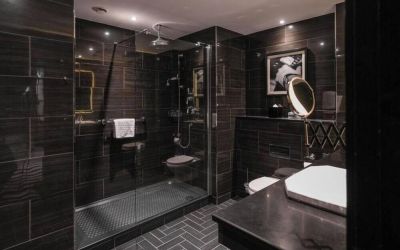 Guest bathroom with shower at Hotel Gotham.  