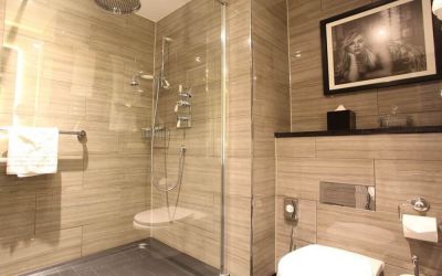 Guest bathroom with shower at Hotel Gotham.  