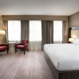 King bed with TV at Leonardo Hotel Cardiff.