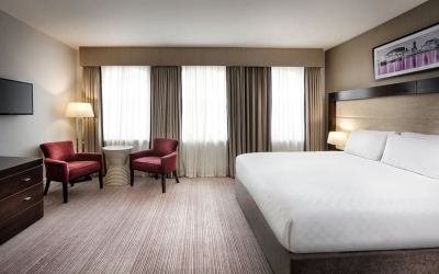 King bed with TV at Leonardo Hotel Cardiff.