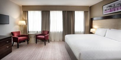 King bed with TV at Leonardo Hotel Cardiff.