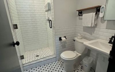 Guest bathroom with shower at Tribeca Hotel FiDi.