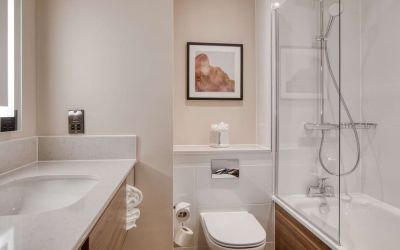 Guest bathroom with shower and tub at DoubleTree by Hilton Dartford Bridge.