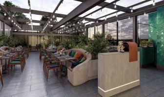 Dining area with natural light at The Gantry London, Curio Collection By Hilton.