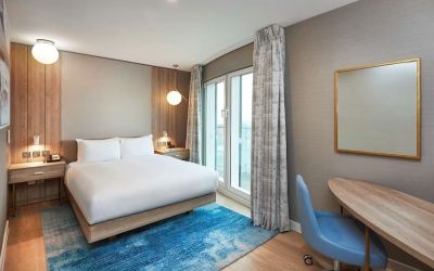 Day use room with work desk and balcony at DoubleTree By Hilton London Excel.