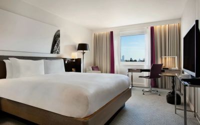 Delux king bed with work desk at Hilton London Angel Islington.
