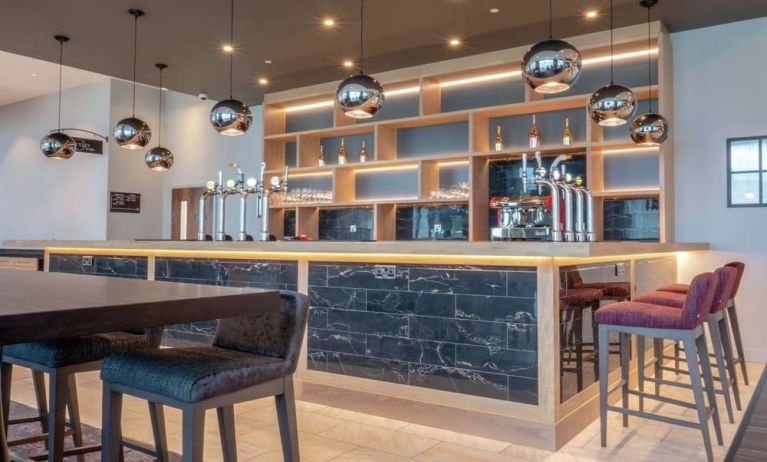 Lobby and coworking lounge at Hilton Garden Inn Birmingham Airport.