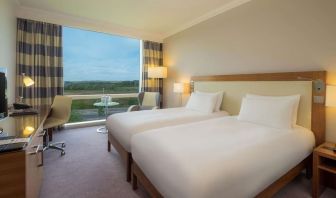 Double bed day use room with work desk and TV at the Hilton Reading.