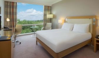 Bright king bedroom with view at the Hilton Reading.