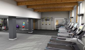 Fitness center with treadmills, machine and equipment at Hilton London Watford.