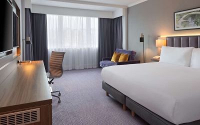 King bedroom with work desk at DoubleTree By Hilton Edinburgh Airport.