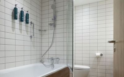 Guest bathroom with shower and tub at Hilton Garden Inn Stoke On Trent.