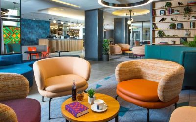 Lobby and coworking lounge at Hampton By Hilton London Park Royal.