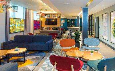 Lobby and coworking lounge at Hampton By Hilton London Park Royal.
