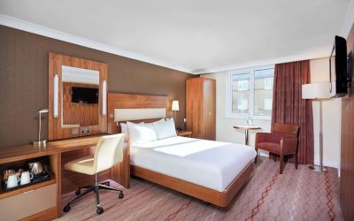 Day use room with TV, work desk and lounge area at the DoubleTree by Hilton Bristol North.