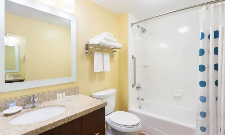 Guest bathroom with shower and tub at TownePlace Suites By Marriott Shreveport-Bossier City.