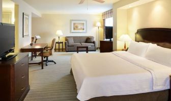Day use studio suite with TV, work desk and living area at Homewood Suites By Hilton Burlington.