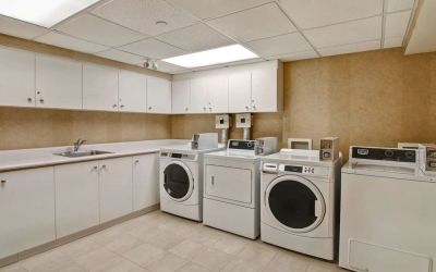 Laundry room at Homewood Suites By Hilton Burlington.