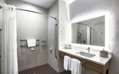 Day use guest bathroom with shower and toiletries at Holiday Inn Express & Suites Airport-Calgary.