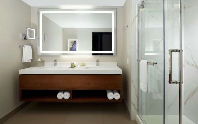 Private guest bathroom with shower and toiletries at DoubleTree By Hilton Montreal Airport.