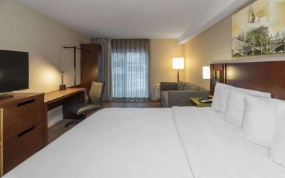 Day use room with work desk and sofa at Comfort Inn Sudbury East.