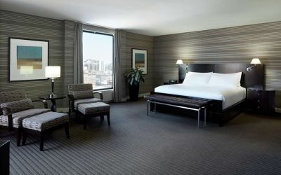 Day use room with work desk, lounge area and private bathroom at DoubleTree By Hilton Montreal.