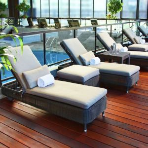 Relaxing indoor pool with lounge chairs at DoubleTree By Hilton Montreal.