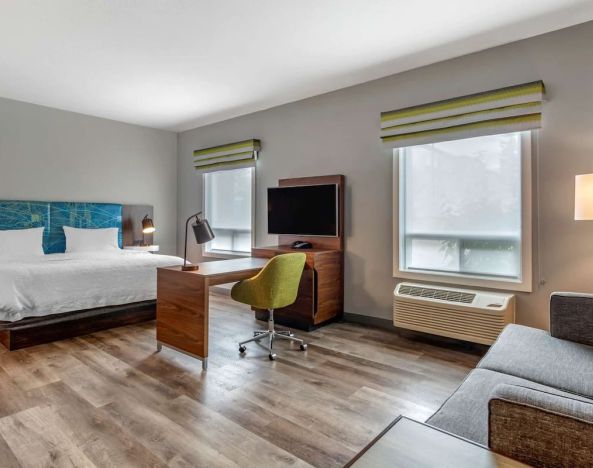Day use studio suite with lounge area, work station and private bathroom at Hampton Inn & Suites By Hilton Edmonton/West.