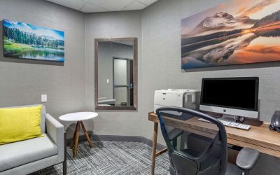 Business center with computer, printer, phone and comfortable mobiliary at Hampton Inn & Suites By Hilton Edmonton/West.