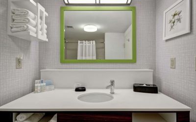 Private bathroom with free toiletries at the  Hampton Inn & Suites By Hilton Guelph.