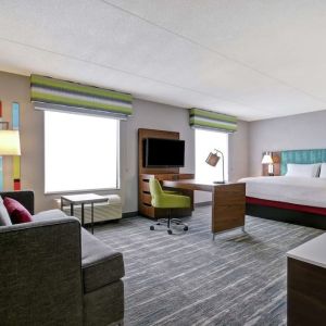 Day use studio suite with work station, lounge area and lounge area at the  Hampton Inn & Suites By Hilton Guelph.